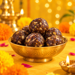 Festive dry fruit ladoos served in a brass bowl