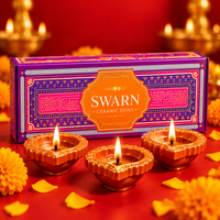 Swarn ceramic diyas box with three lit diyas