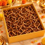 Plain yellow gift box with festive paper filler