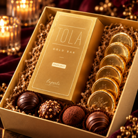 Aurum Noir Luxe Hamper open showing Tola Gold Bar, chocolate gold coins and truffles